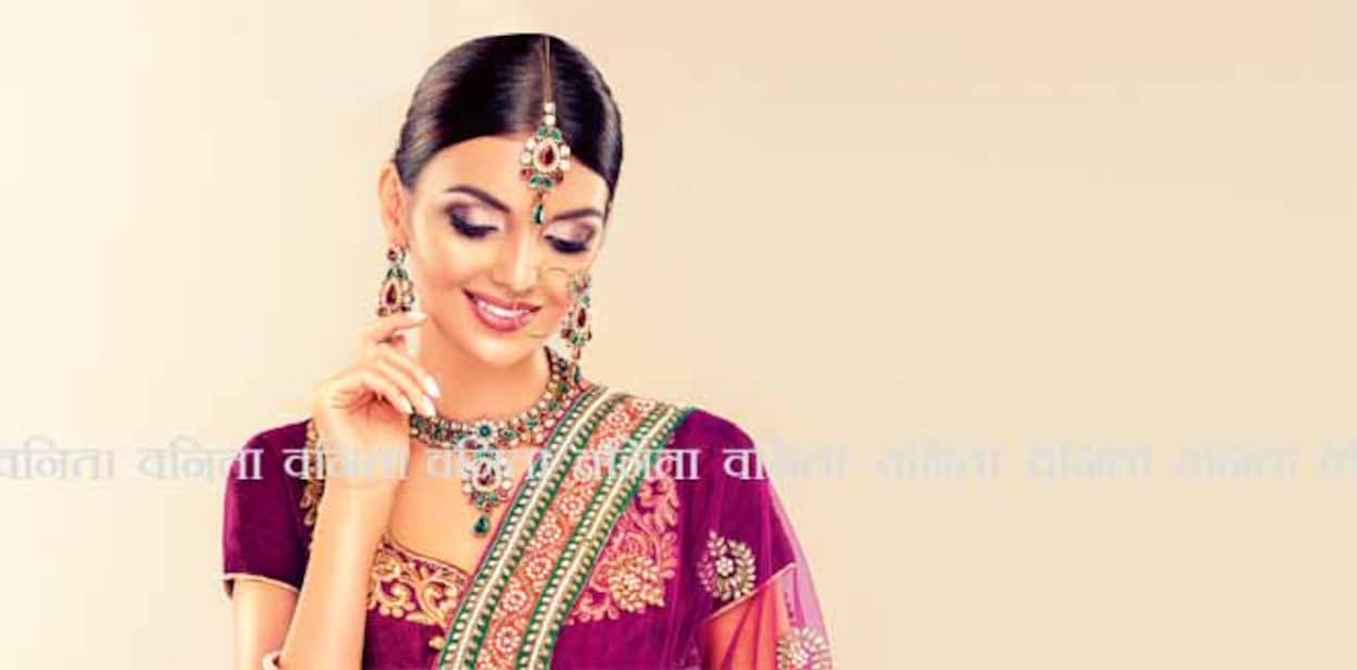 Portrait of beautiful indian girl. Young India woman model with kundan jewelry set. Traditional Indian costume lehenga choli or sari