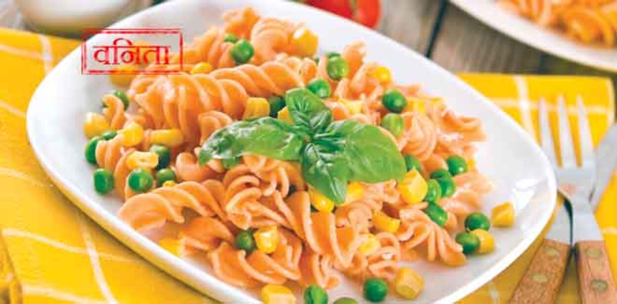 Fusilli pasta with peas and sweet corn.