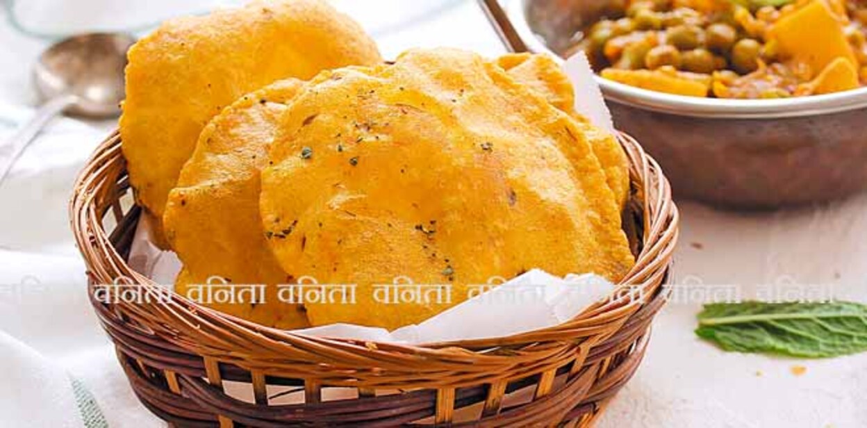 1050589982 Homemade Indian Potato Poori or Puri served with Alu Matar, selective focus