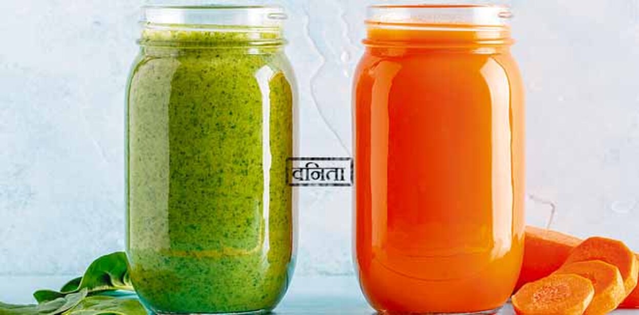 detox-2 Orange/green colored smoothies / juice in a jar on a blue background.