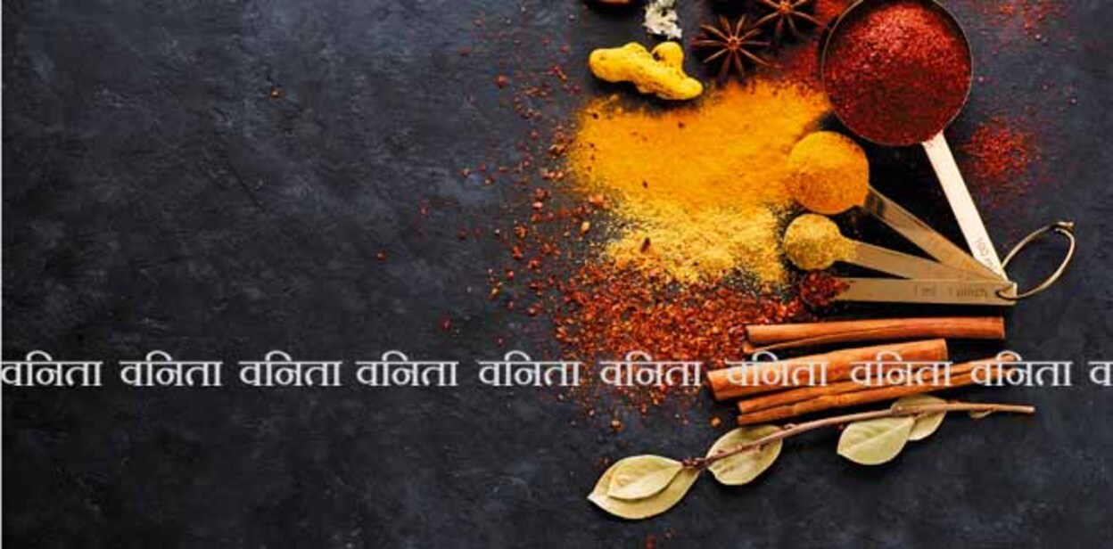 Selection spices, spicy and herbs in metal spoons, top view