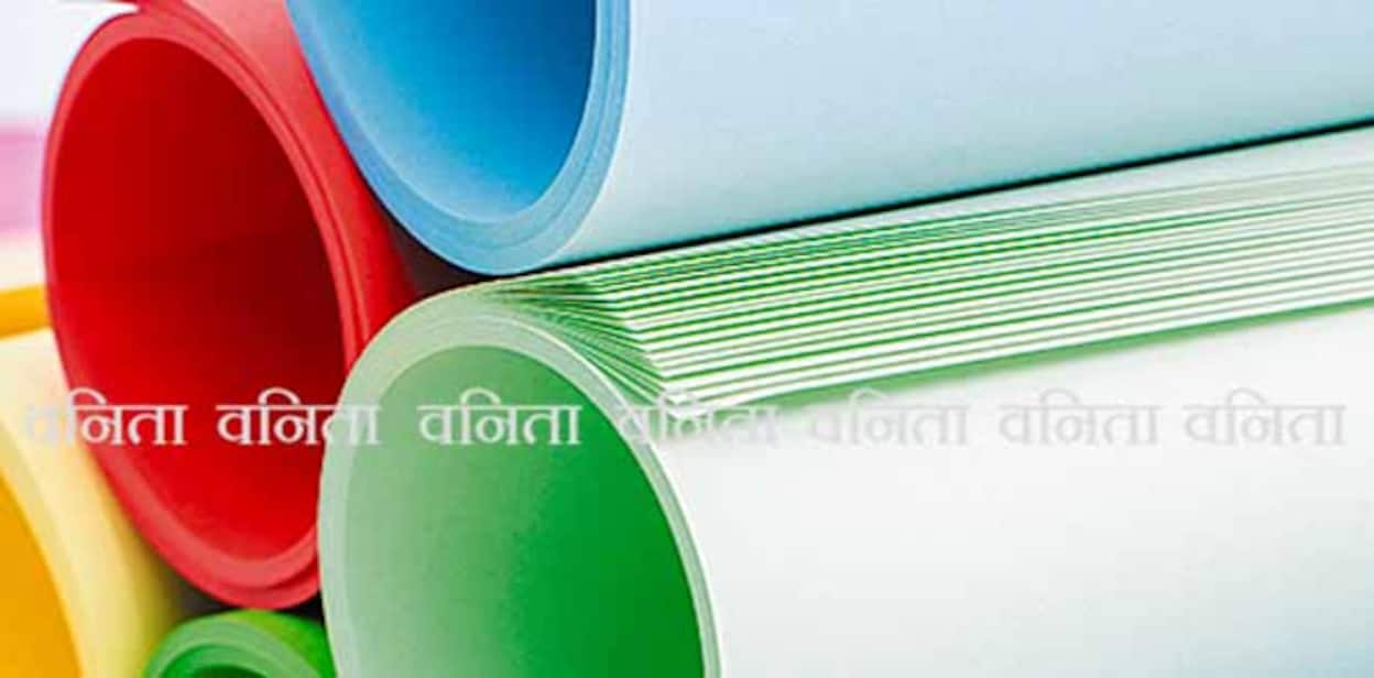 Roles of color paper. Color paper rolled and piled. Stack of paper on multicolor background.