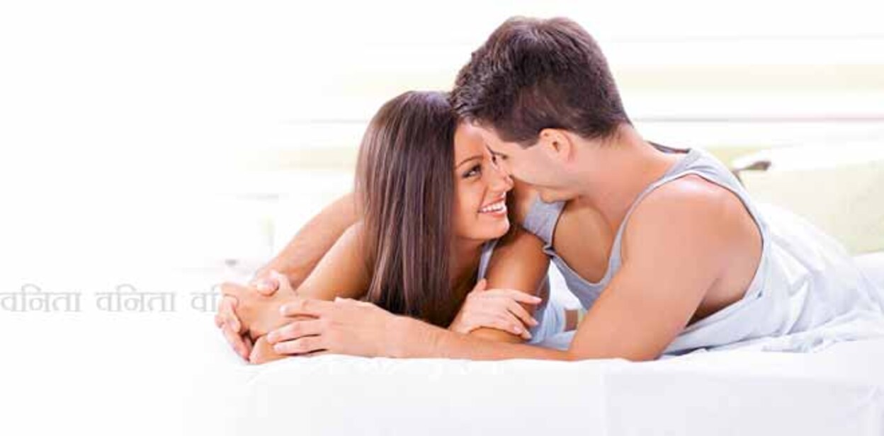 Young love couple in bed, romantic scene in bedroom