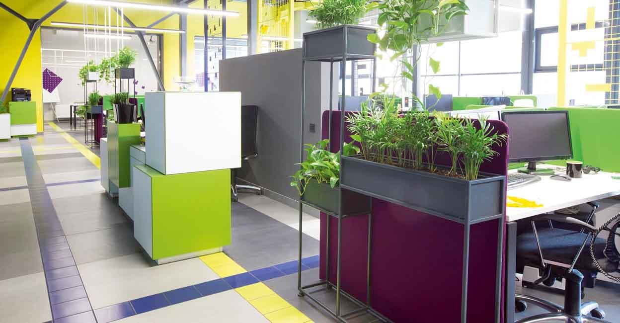 Open space interior with green plants and places for workers, no people, quarantine time, copy space