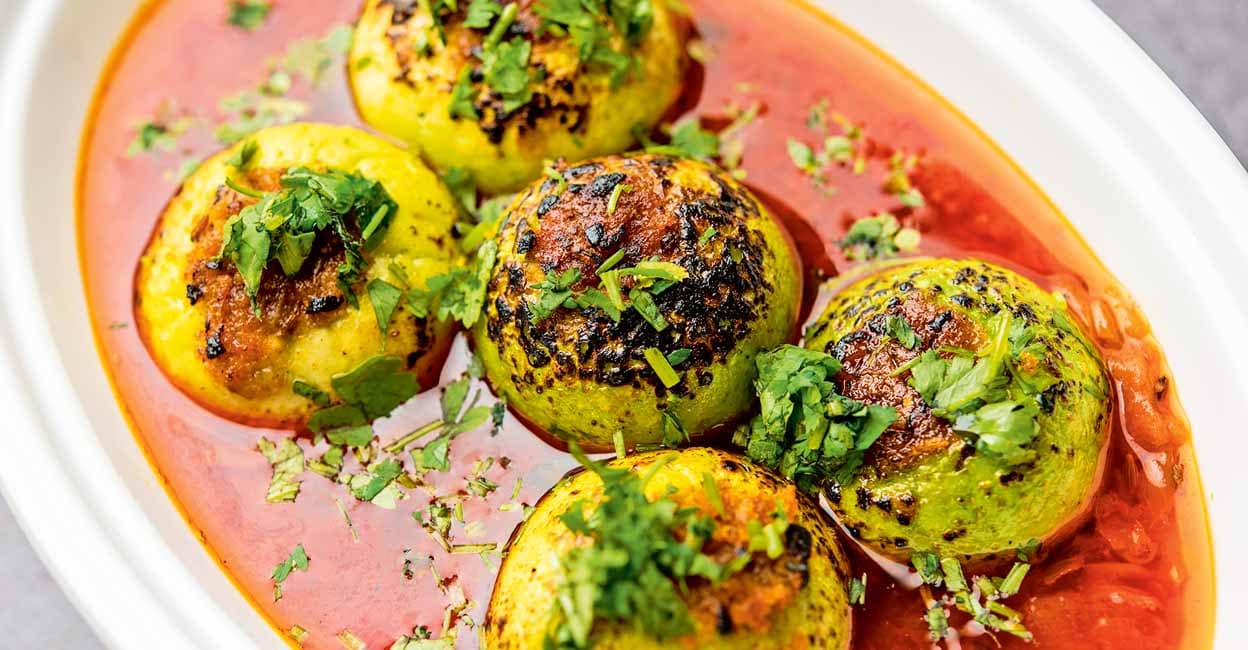 Indian style Tinda or Tinde ki Sabzi also called Indian squash, round melon, Indian round gourd or Indian baby pumpkin, stuffed, stir fried dry or curry recipe