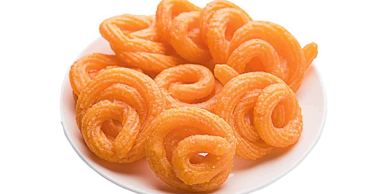 Sweet Paneer Jalebi served in a ceramic plate over colourful or wooden background. Selective focus